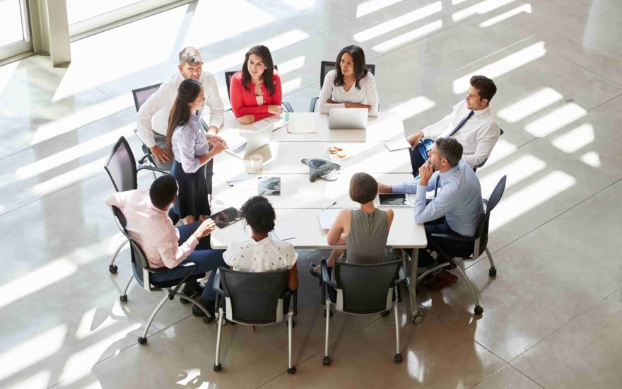 businesswoman-addressing-colleagues-at-table-elev-2024-10-20-08-54-57-utc_11zon